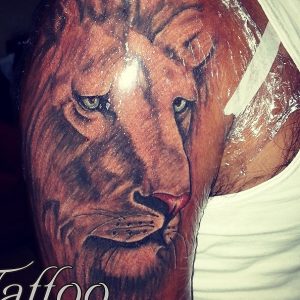 Lion Colored & Grey Tattoo by Mahesh Ogania