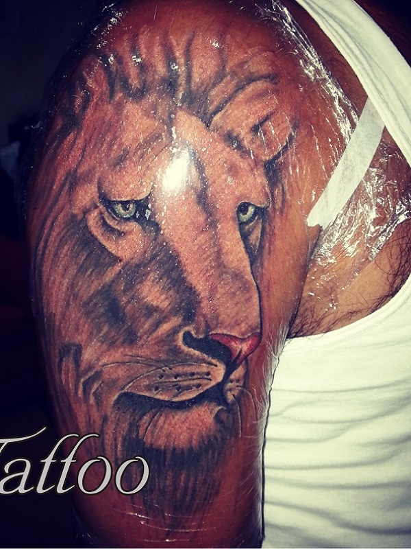Lion Colored & Grey Tattoo by Mahesh Ogania