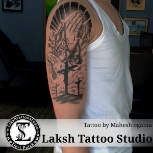 Cross with hand arm tattoo, by Mahesh Ogania